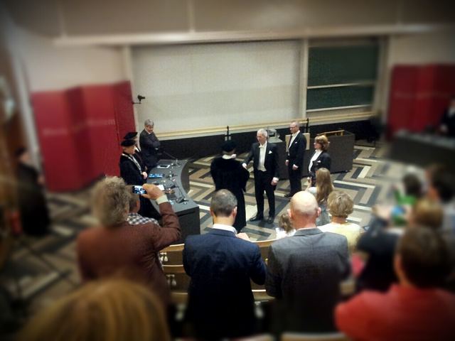 The defense seen from the audience, with the committee in gowns at the front.